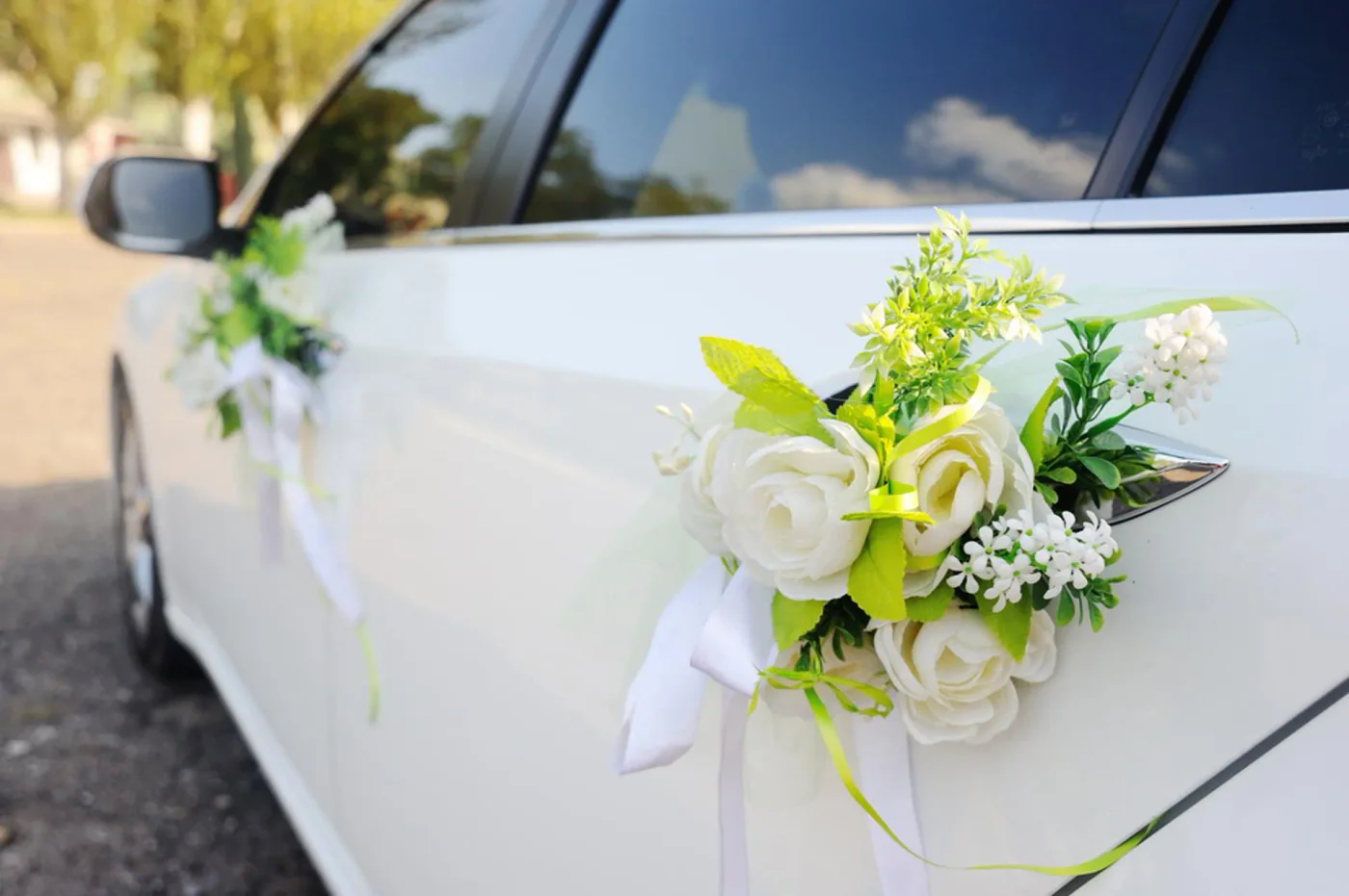 White car door with an ivory floral and ribbon detail