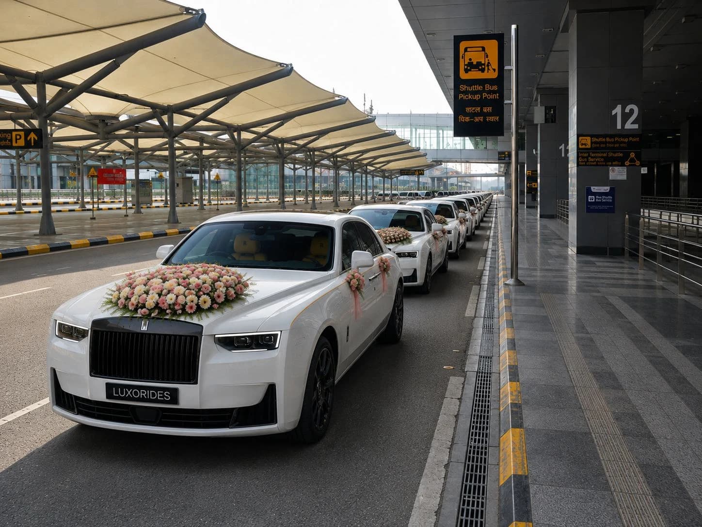White Rolls-Royce wedding cars ready for guest transfers
